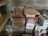 a pile of books sitting on top of a wooden table