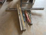 a lot of skis that are laying on the floor