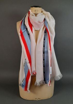 striped scarf on a mannequin head on a mannequin display