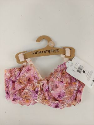 a close up of a pink bra top on a hanger