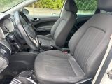 the interior of a car with two seats and a steering wheel