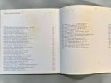 an open book with a list on it on a table