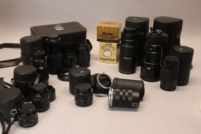 many different types of cameras sitting on a table