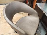 a chair that is sitting in the corner of a room