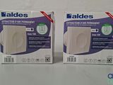 two boxes of toilet paper sitting on top of a white table