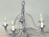a chandelier with five lights hanging from it