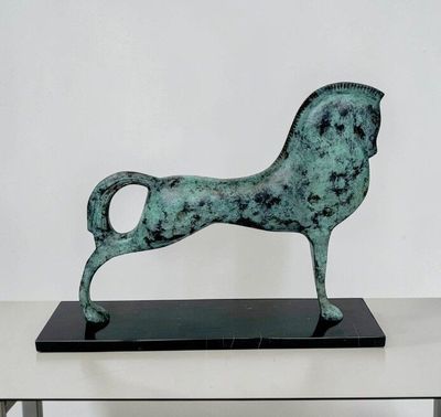 a statue of a horse that is on a table