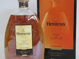 an image of a bottle of hennessy finest cognal next to a box