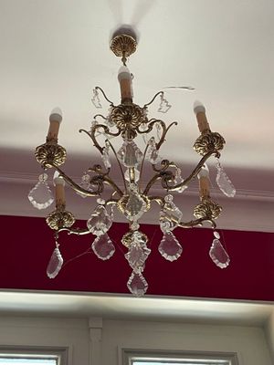 a chandelier hanging from the ceiling in a room