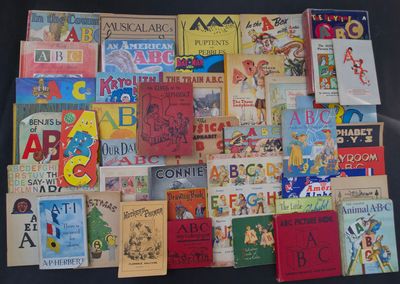 a lot of children ' s books on display on the table
