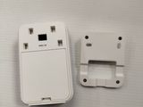 a small white device that is sitting on a table