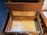 a wooden box that is open on the floor