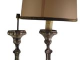 pair of antique brass table lamps with shades on each of them