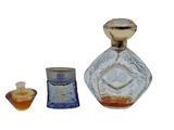a small glass bottle with a candle inside of it