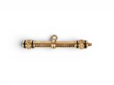 a gold plated brass screw with a black stripe on the end of it