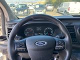 a close up of a steering wheel and dashboard of a car