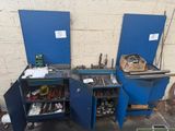 two blue cabinets with tools in them in a garage
