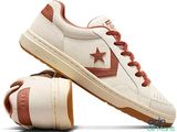 a close up of a pair of shoes with a star on them