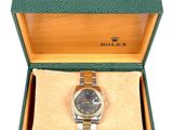 an image of a rolex watch in a box on a white background