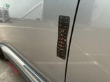 a sticker on the side of a silver car