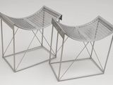 pair of silver metal stools on a white background