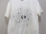 a white t - shirt with a sun and moon design on it