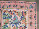 an image of a pink scarf with a floral design