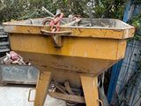 a large yellow wheelbarrow that is sitting in a yard