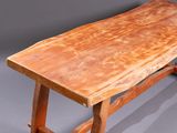 an image of a wooden table with a thick slab of wood on top of it