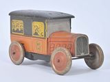 a small toy truck with a black top and red wheels