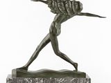 a bronze statue of a man holding a baseball bat on a marble base