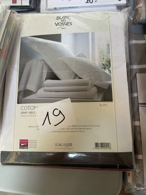 a box of bedding on a table with a price tag on it