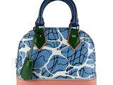 the blue and white handbag has a pink handle and a green handle