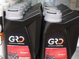 several bottles of motor oil on a shelf in a store