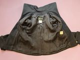 the skirt is black and has a yellow tag on it