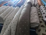 many different types of blankets on display in a store