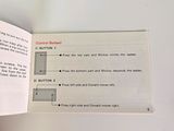 a hand holding an open book with instructions on it
