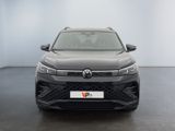 the front view of a grey volkswagen suv parked in a room
