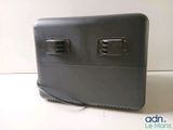 an image of a black suitcase with two usb ports