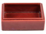 rectangular red ceramic box with lid on white background