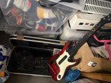 a guitar that is sitting on top of a suitcase