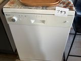 a dishwasher sitting on a counter in a kitchen