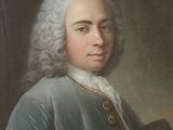portrait of a man in a blue coat holding a brush