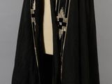 an image of a black and gold cape with a star design on it