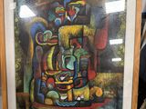 a framed painting of a vase and a vase on a table