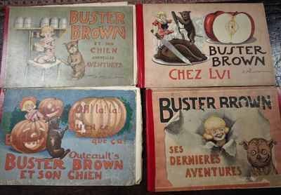 four vintage children ' s books are lined up on a table