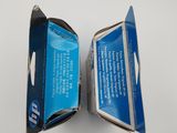 a box of toothpaste sitting on a white surface