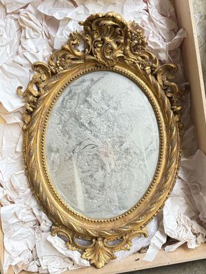 a box with a mirror inside of it on a table