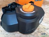 a black and orange blower sitting on top of a wooden floor