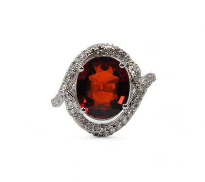 an oval garnet garnetite and diamond ring